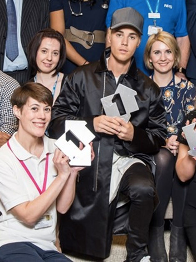 WATCH: Justin Bieber high-fives the NHS Choir as he celebrates their charity single beating him to number one