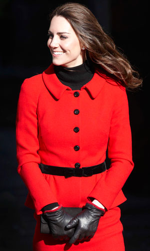 Kate Middleton wearing a red and black suit on a royal visit to Scotland