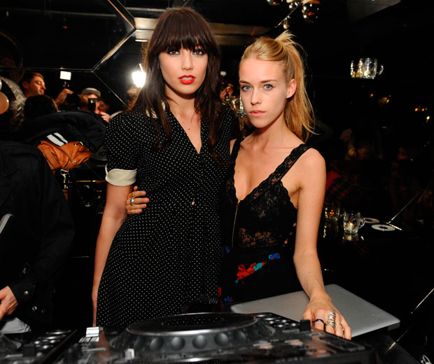 Models Daisy Lowe and Mary Charteris DJ at a party in London