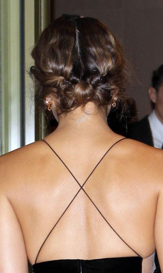 Jessica Alba Shows Off Her Delicate Dress With A Knotted Up Do Hairstyle. 2011