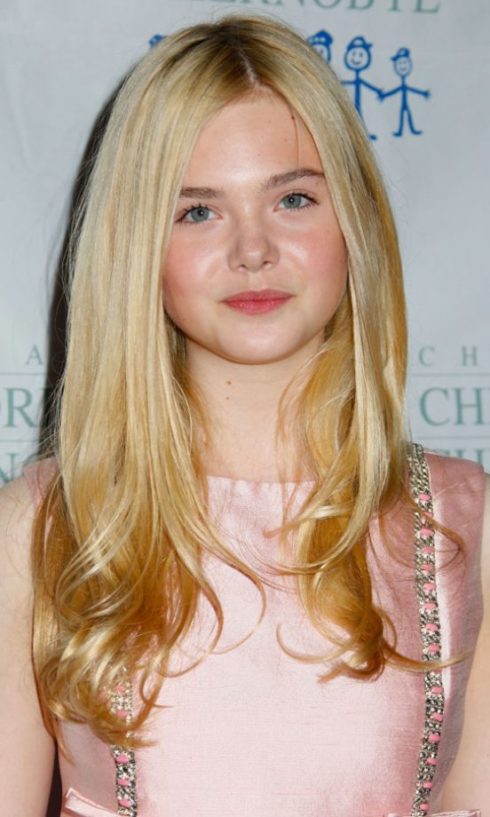 Elle Fanning Gives Her Hairstyle Some Volume With A Cute Flick To The Ends. 2011