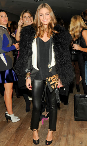 Olivia Palermo wearing a fur gilet over a blazer with leather trousers