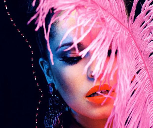 Cheryl Cole pinched a feather from the 2009 BRITs for her calendar (probably)