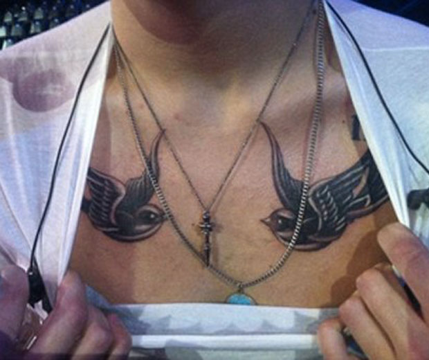 Harry Styles showed off his two new tattoos on Twitter