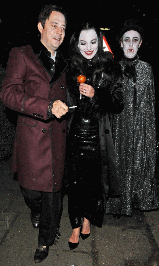 Kate Moss and Jamie Hince dressed as the Adam's Family on Halloween