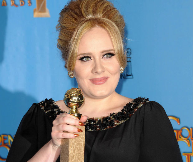 Adele has been spotted wearing a gold necklace bearing the name 'Angelo'