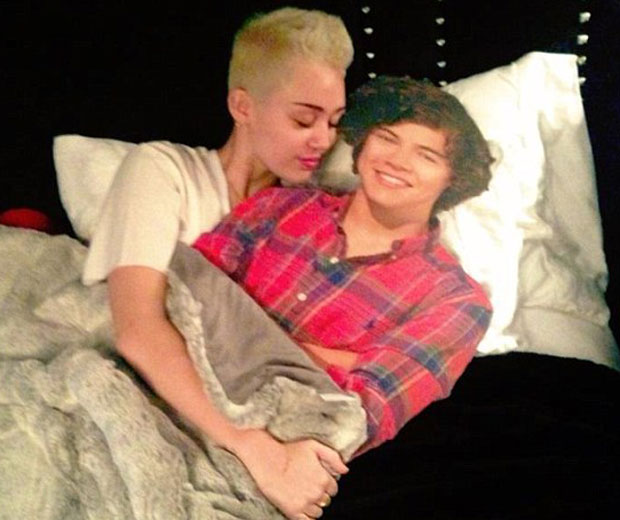 Miley Cyrus posted a snap online of her hugging Harry Styles in bed