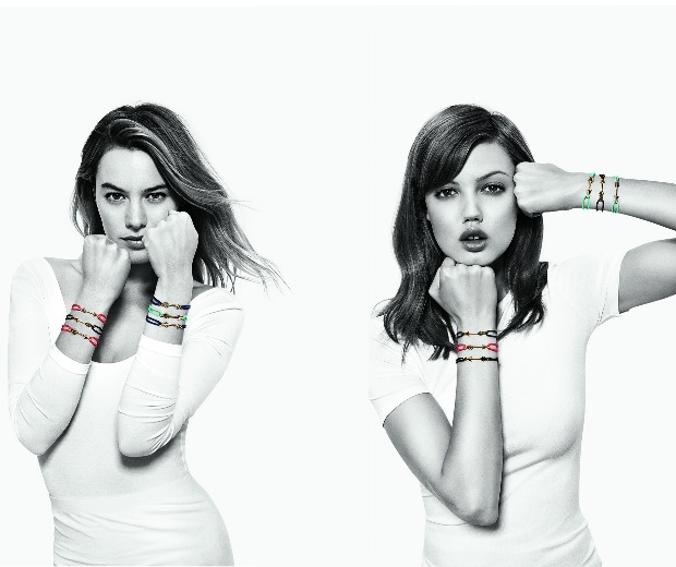 Models Camille Rowe and Lindsey Wixson front Aldo's #FRIENDSFIGHT against AIDS, wearing the brand's charity friendship bracelets