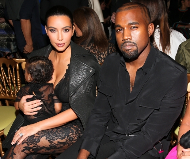 Kim Kardashian and Kanye West front row