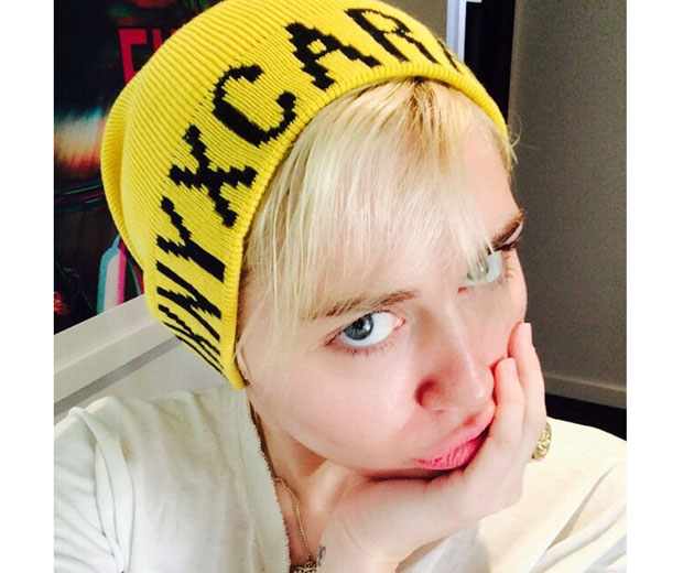 Miley rocking her new DKNY X Cara beanie