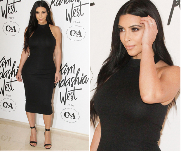 Kim Kardashian works a black skintight dress from her collection for C&A