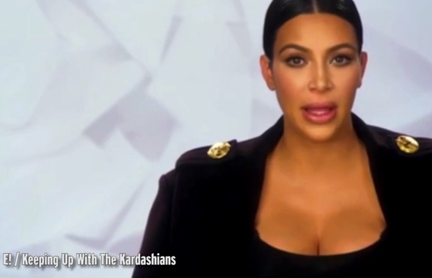 Kim has a word with Kylie before she walks in Kanye West's NYFW show...
