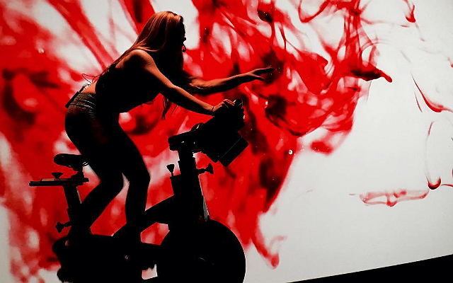 Spinning Classes In Front Of IMAX Screens Are The Latest Fitness Trend