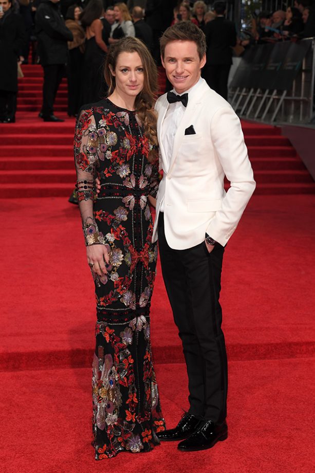 Eddie Redmayne looked sharp in his white tux. We’re loving Hannah’s sheer embroidered gown, too