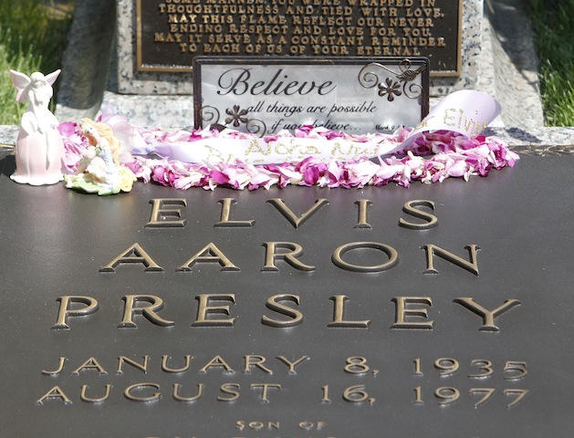 The grave of Elvis Presley with flowers