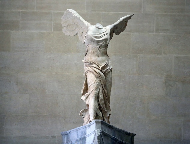 The Victory of Samothrace scultpture, after is was reinstalled at the top of the Daru staircase, at the Louvre museum in Paris, Thursday July 10, 2014. The 2,200-year-old, 29-ton statue, is back after almost a year of restoration. The Victory of Samothrace is one of the five most popular works at the Louvre Museum, which attracts almost 10 million visitors a year. (AP Photo/Remy de la Mauviniere)