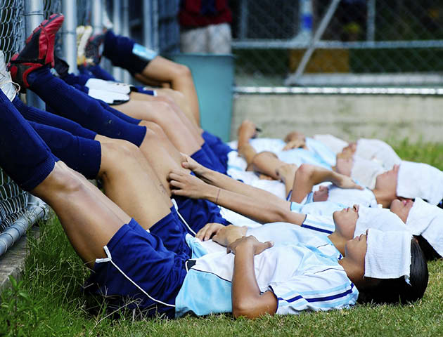 Female football players lying down