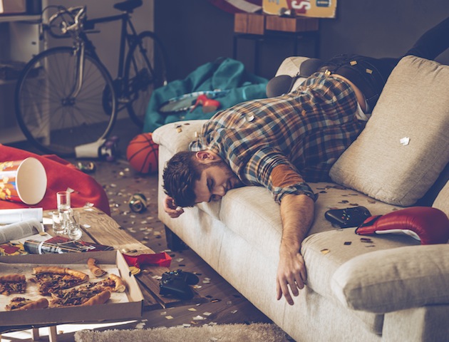 Drunk: man collapsed on sofa
