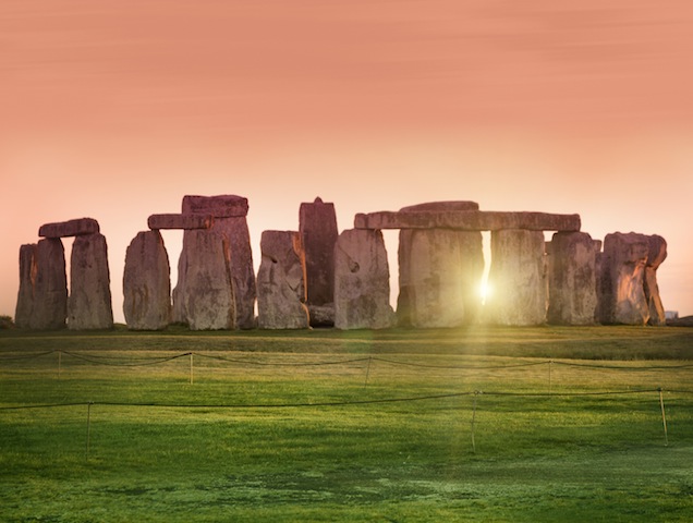 The prehistoric monument of Stonehenge in England. Focus is on the grass.