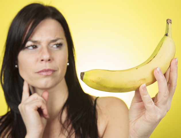 image of woman looking at a banana