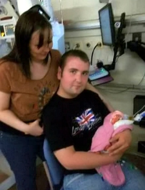 SWNS - With baby Scarlett