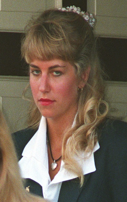 ** FILE ** Karla Homolka leaves her family home in St. Catharines, Ont., in this July 6, 1993 file photo. Homolka was released from prison Monday, July 4, 2005 after serving 12 years for the rapes and murders of three teenage girls, including her younger sister. (AP Photo/CP, Frank Gunn)