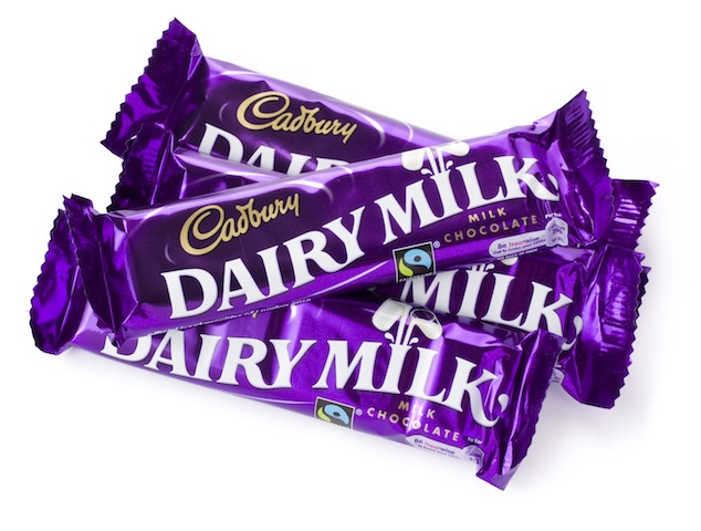 St Ives, England - August 15, 2011: Four 40g Cadbury Dairy Milk Chocolate Bars isolated on a white background.