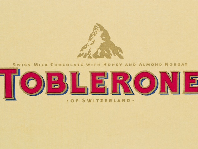 "Arad, Romania - March 25, 2012: Toblerone logo printed on cardboard. Toblerone is a chocolate bar brand owned by Kraft Foods. Studio shot."