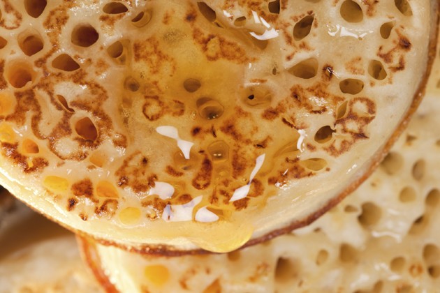 british toasted crumpet with honey, closeup background