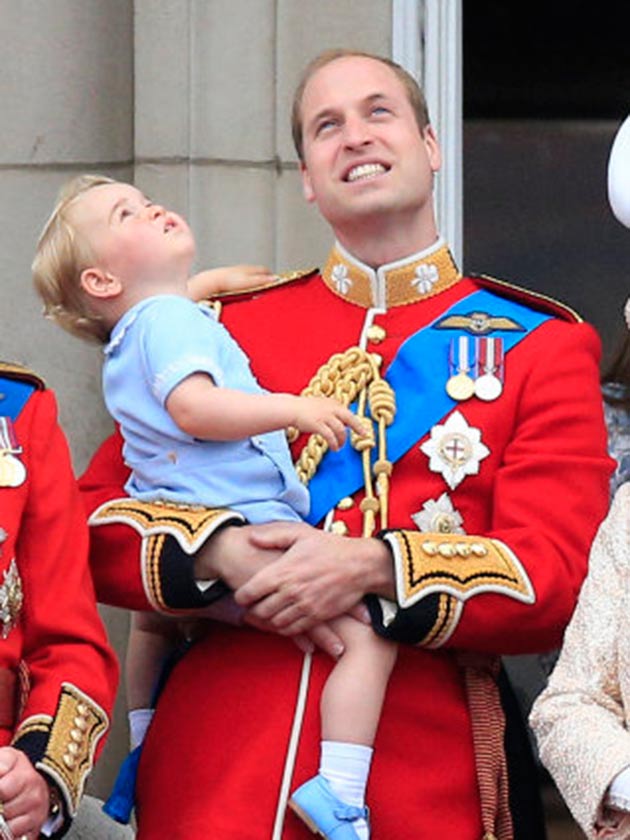 Prince William holds Prince George