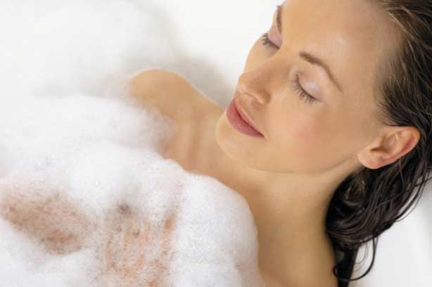 A woman relaxing in the bath