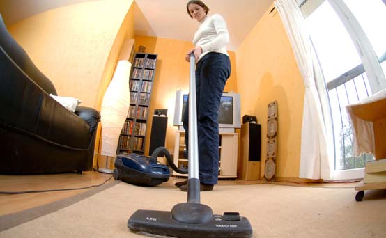 A woman vacuuming