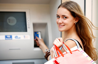 Teenager at cashpoint