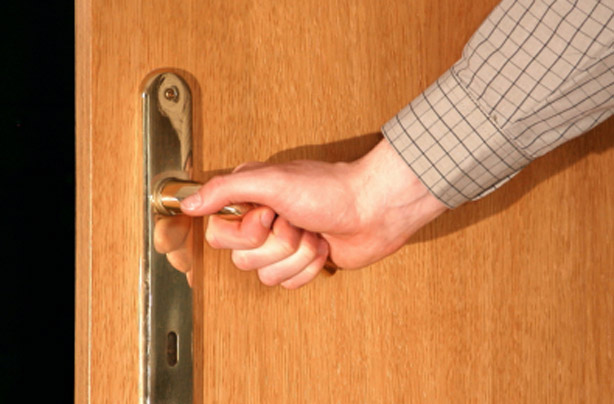 Woman shutting door