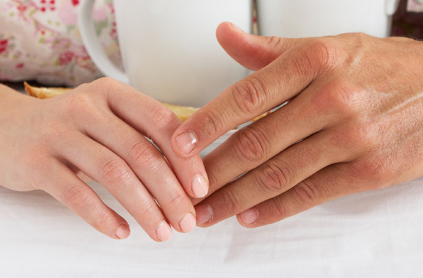 Couple holding hands