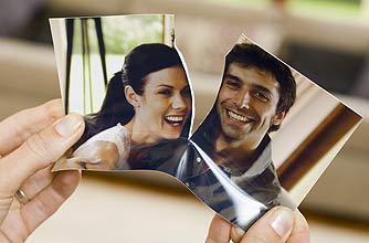 a torn photo symbolising a split