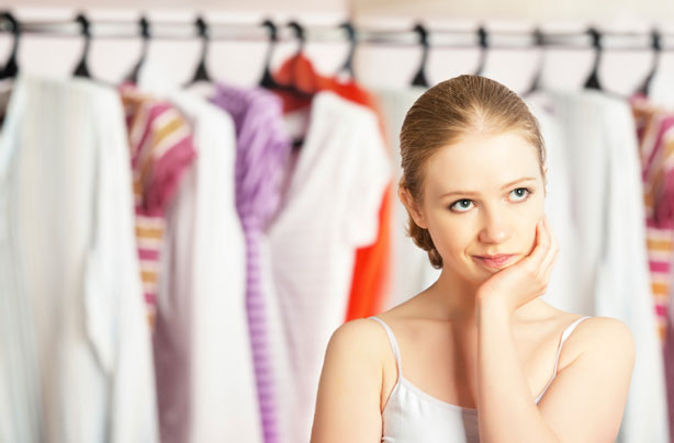 Woman in front of clothes, wardrobe, dressing