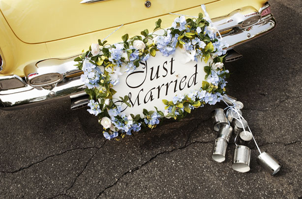 Just married couple in a car