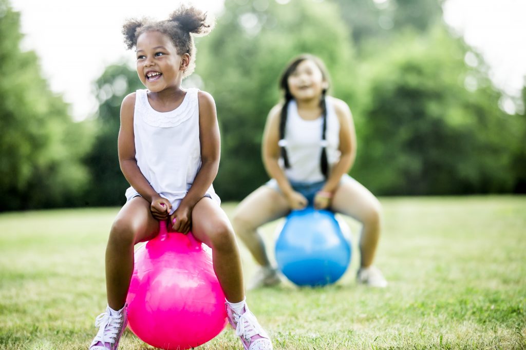 children on space hoppers