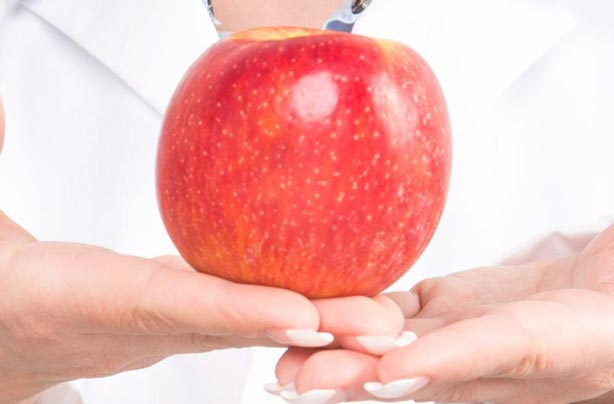 Woman holding an apple