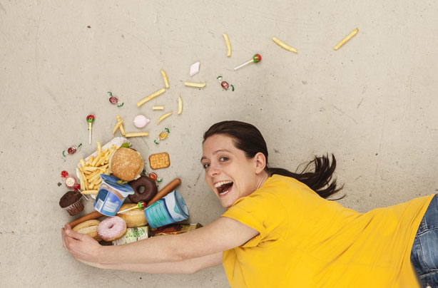 Woman juggling food
