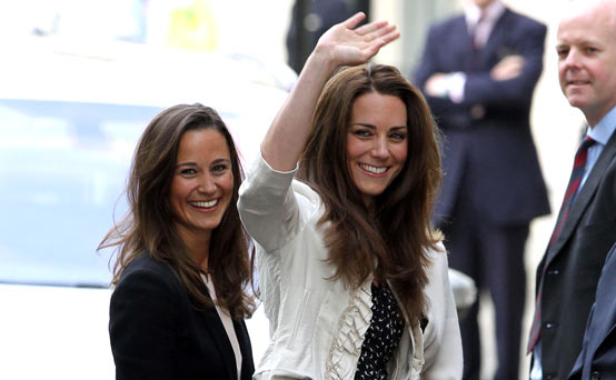 Kate Middleton waves to the crowds the night before her wedding