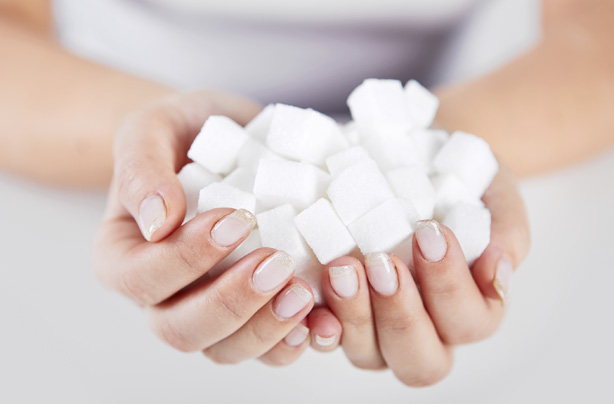 Woman holding sugar cubes