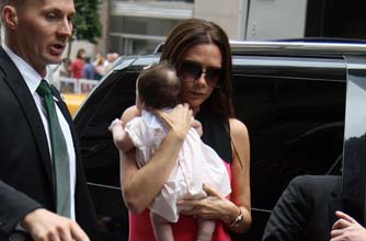Posh holding Harper Beckham