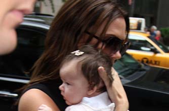 Posh holding Harper