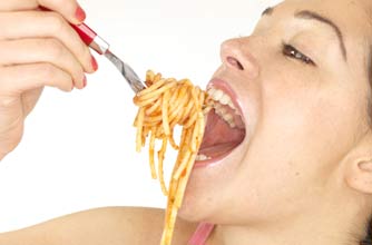 Woman eating spaghetti
