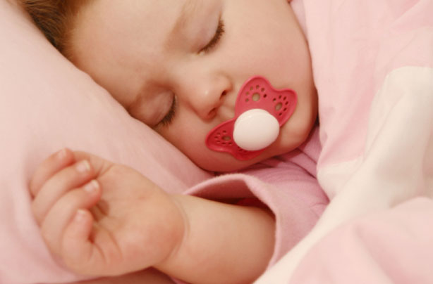 Baby asleep with dummy