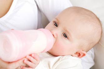 Baby being bottle fed