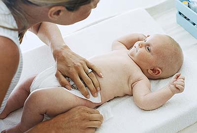 Baby being changed on a mat