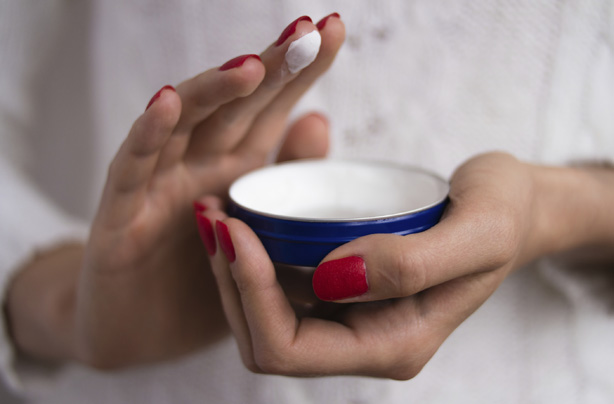 Woman applying cream, moisturiser, how to get rid of cellulite